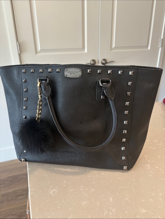 Michael Kors Handbags - Michael Kors Black Studded Tote with Pom Key Charm